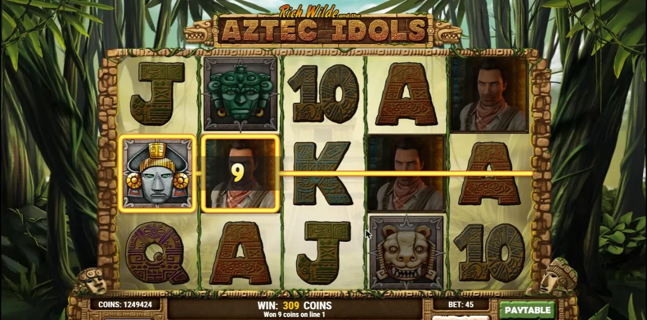 Aztec Idols base spin 29 at a $0.90 bet: a grey mask and Rich Wilde wild on line 1, wilds on reels 2, 4 and 5, WIN 309 COINS, BET 45