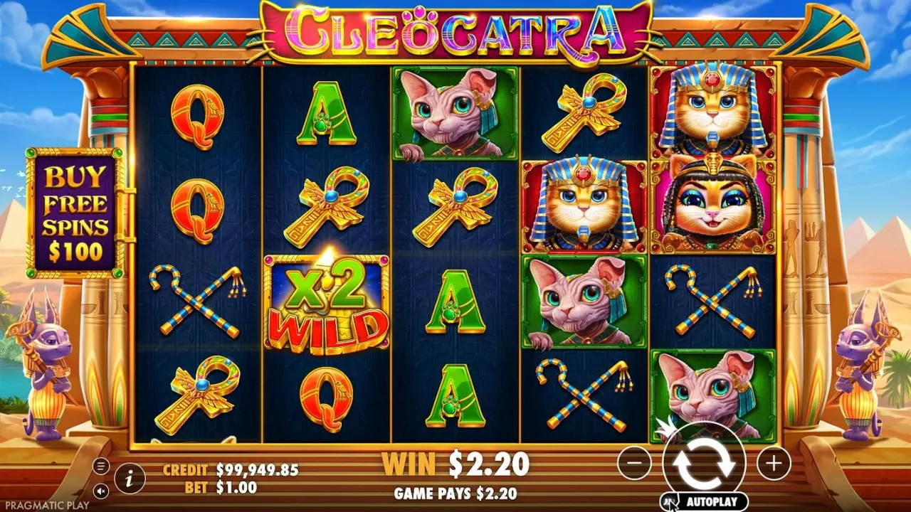Cleocatra base game at a $1 bet: 5x4 reels of cats, ankhs and card symbols in a sandstone temple, a x2 WILD on reel 2, WIN $2.20